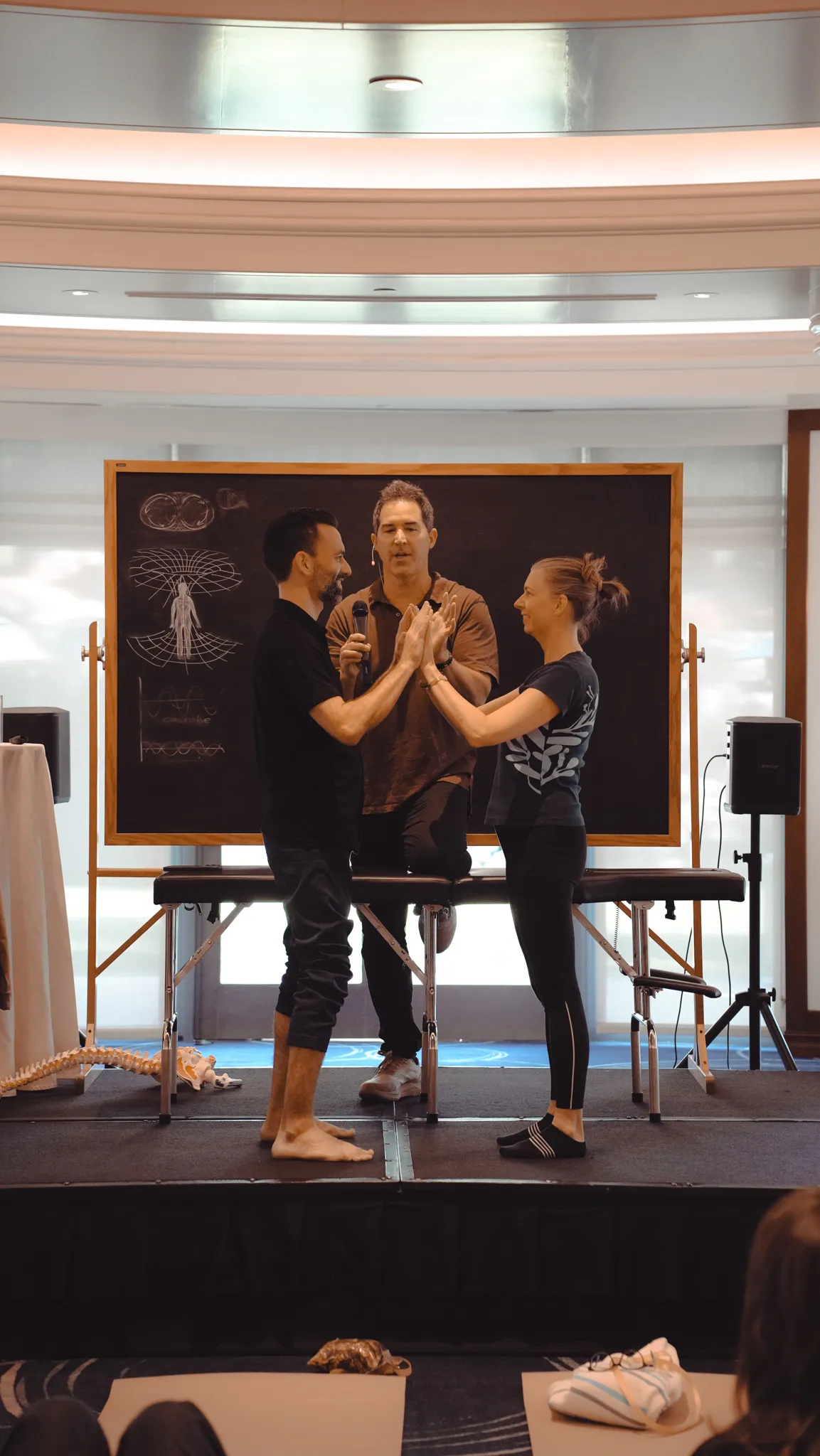 André on stage with Dr. John Amaral, demonstrating at his workshop