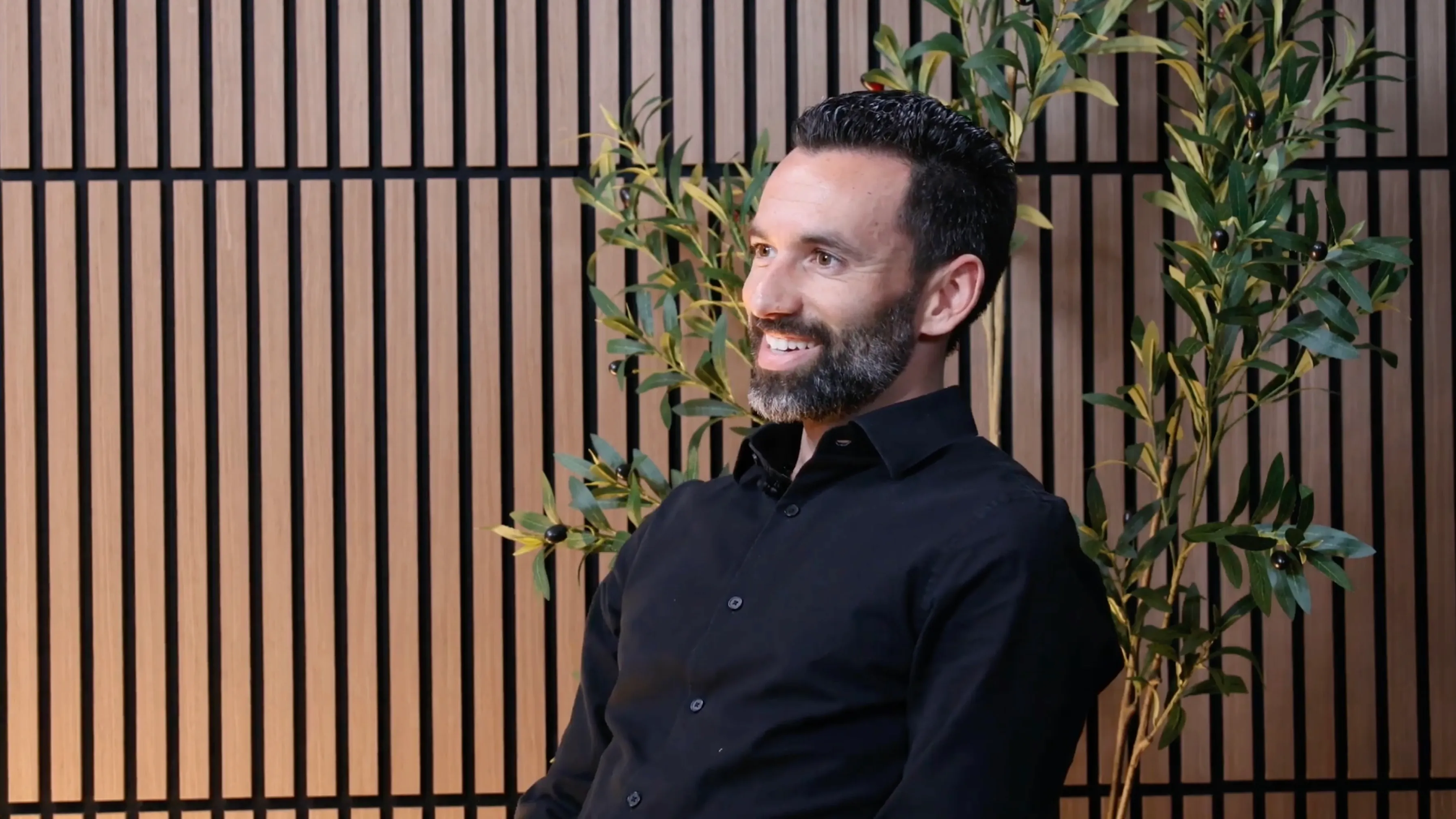 André Crabb smiling during an interview